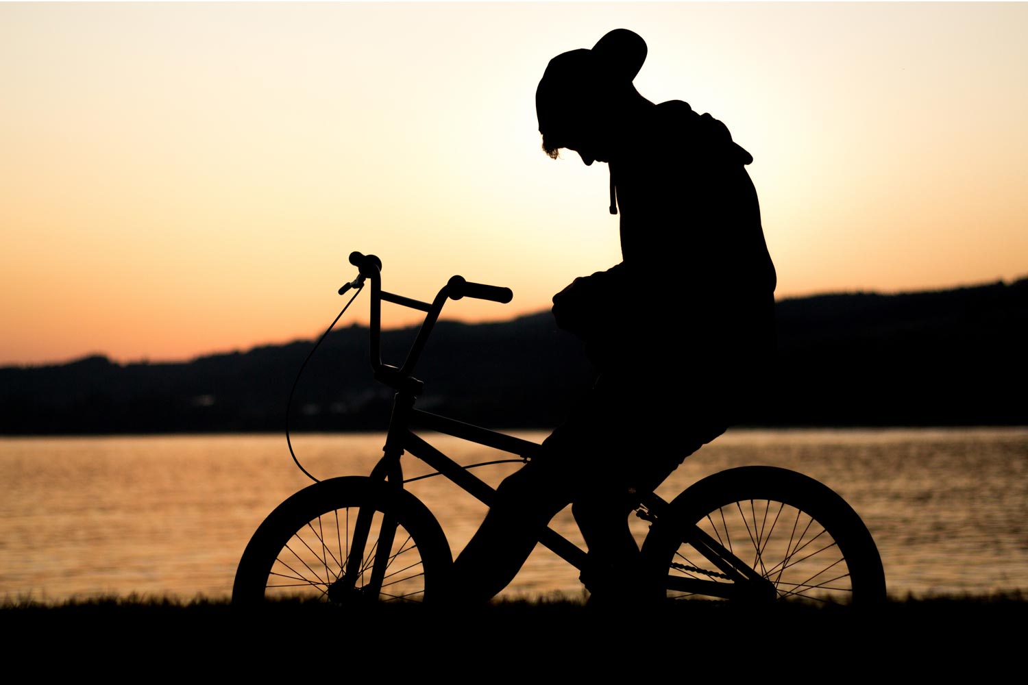 Person on bicycle at sunset